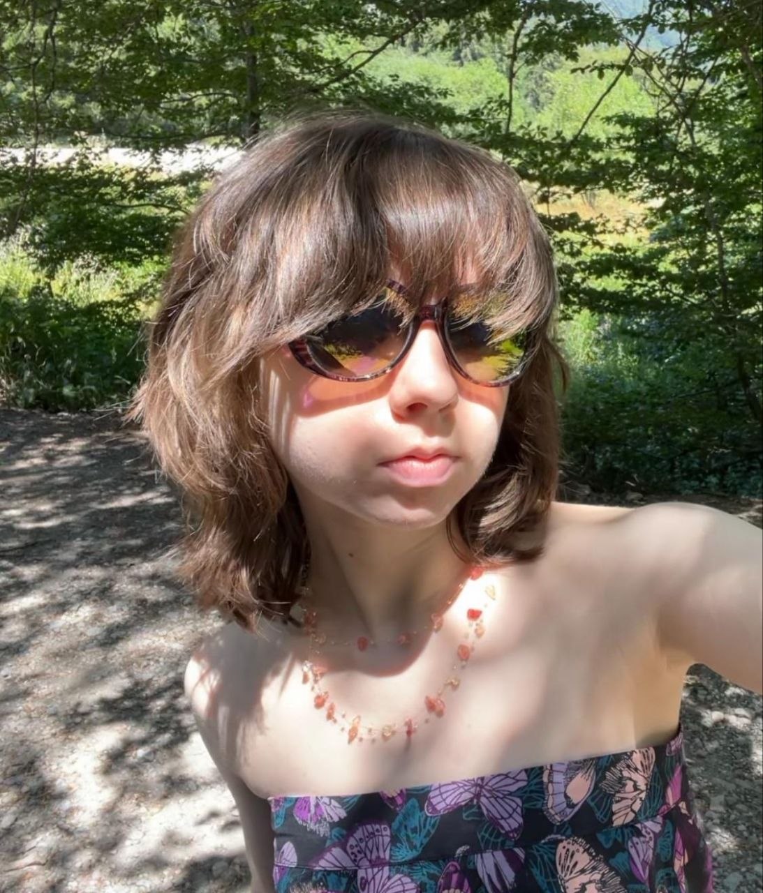 The artist outdoors in a wooded park
